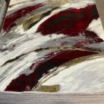 Modern abstract brushstroke design with vibrant red