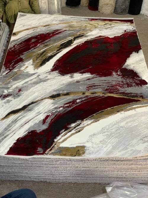 Modern abstract brushstroke design with vibrant red